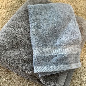 Gray bathroom towels, large body towel and small hand towel